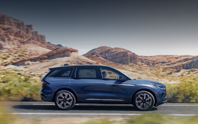 A 2024 Lincoln Nautilus® SUV is being driven in a desert setting. | Holmes Tuttle Lincoln in Tucson AZ