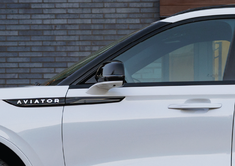 The driver’s door of a white 2025 Lincoln Aviator® SUV is showcased. | Holmes Tuttle Lincoln in Tucson AZ