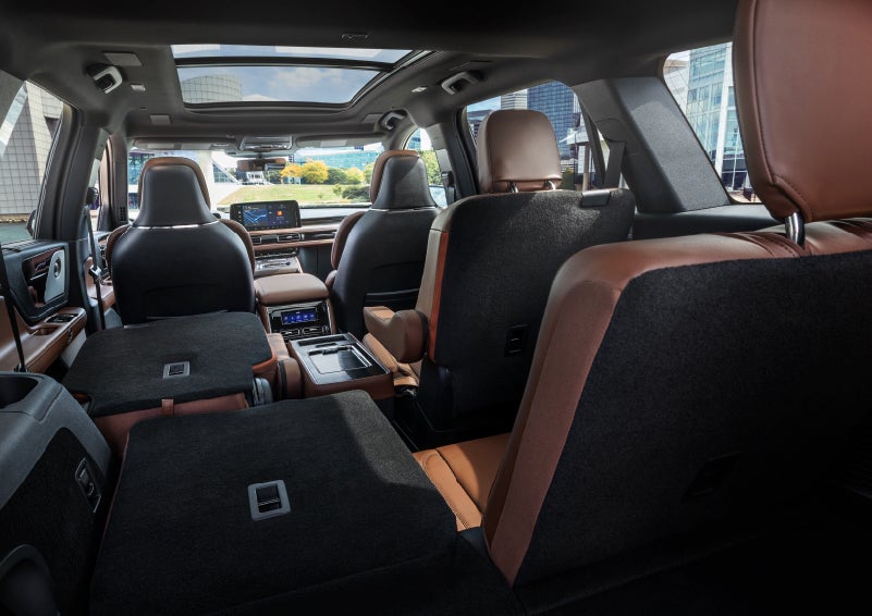 The interior of the 2025 Lincoln Aviator® SUV is shown with two seats folded down for added space. | Holmes Tuttle Lincoln in Tucson AZ