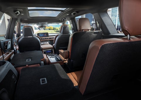 The interior of the 2025 Lincoln Aviator® SUV is shown with two seats folded down for added space. | Holmes Tuttle Lincoln in Tucson AZ