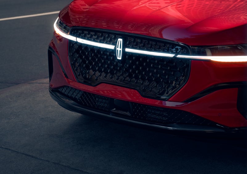 The available front LED light bar and center Lincoln Star logo glow at dusk. | Holmes Tuttle Lincoln in Tucson AZ