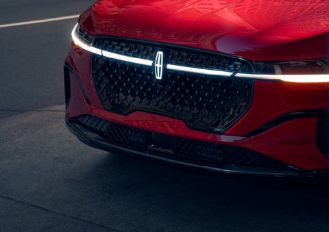 The available front LED light bar and center Lincoln Star logo glow at dusk. | Holmes Tuttle Lincoln in Tucson AZ