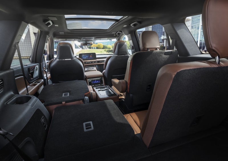 One side of the PowerFold® third-row seat and a second-row seat are folded forward in the 2026 Lincoln Aviator® SUV. | Holmes Tuttle Lincoln in Tucson AZ
