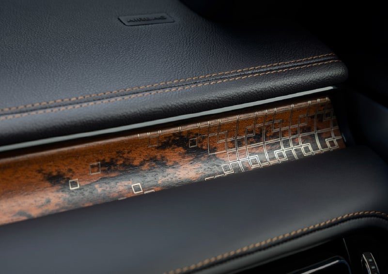 A close-up shot of the 2026 Lincoln Aviator® dashboard with unique black and brown accents and brown stitching. | Holmes Tuttle Lincoln in Tucson AZ