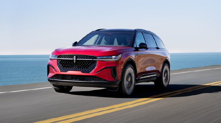 A 2026 Lincoln Nautilus® SUV is being driven on a seaside roadway. | Holmes Tuttle Lincoln in Tucson AZ