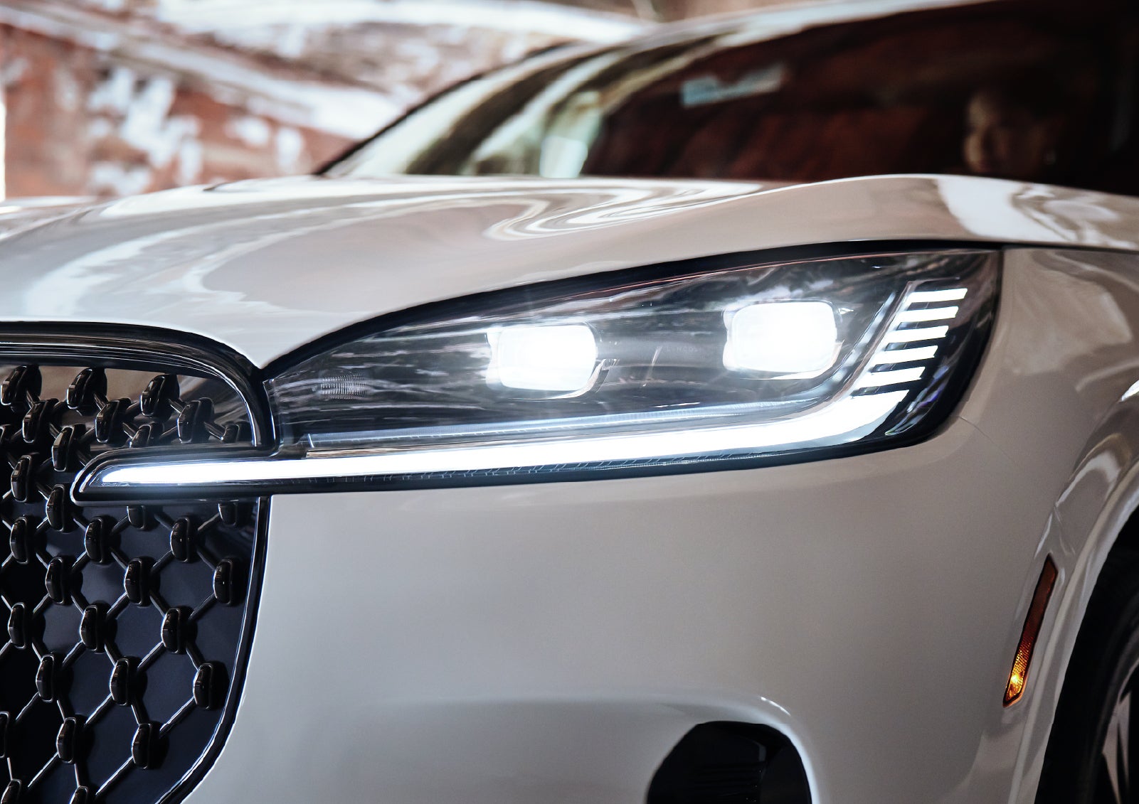 A close-up of a headlamp on the 2027 Lincoln Aviator® SUV is shown. | Holmes Tuttle Lincoln in Tucson AZ