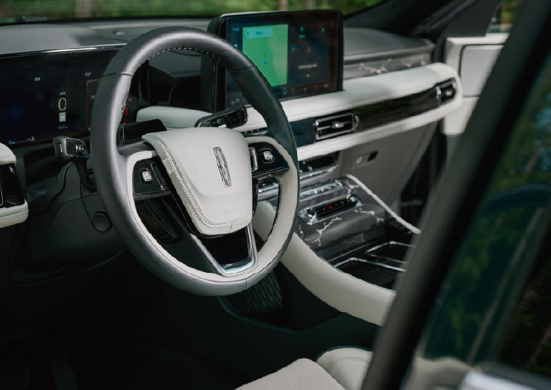 The leather-trimmed steering wheel of a 2027 Lincoln Aviator® Black Label™ SUV. | Holmes Tuttle Lincoln in Tucson AZ