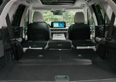 A rear to front view of the interior of a 2027 Lincoln Aviator® Black Label™ SUV shows the third and second rows folded flat | Holmes Tuttle Lincoln in Tucson AZ
