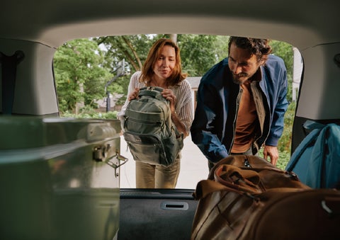 A couple loads luggage into the rear of a 2027 Lincoln Aviator® Black Label™ SUV..e 202 | Holmes Tuttle Lincoln in Tucson AZ